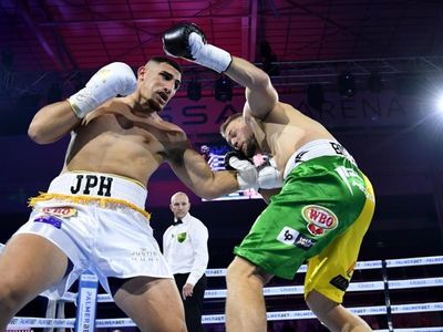 Bloodied Huni too classy in boxing return