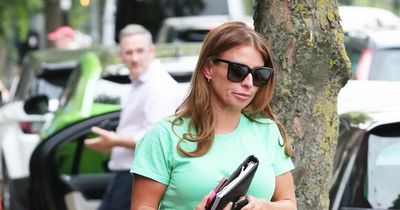 Coleen Rooney styles out medical boot for injury with denim shorts as she emerges from hair salon