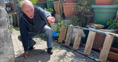 Man so angry over his neighbours' new wall he drilled holes in it