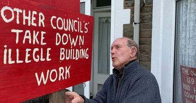Pensioner left so angry about neighbour's new wall he drilled holes into it