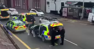 Two arrested after armed police descend on Scots street