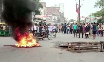 Trains and tyres burn as Indians protest against loss of army job security