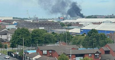 Black smoke billows over Wirral after fire at fly-tipping hotspot