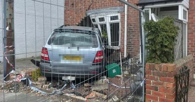 'I heard an almighty bang': Neighbours left stunned after car smashes through house