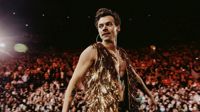 Tell Us Why You’d Froth Going To Harry Styles’ Show We May Sling Ya $1k To Spend On Tix