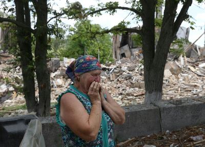 Ukraine's Zelensky visits war-torn southern city as battles rage