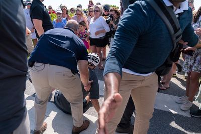 Biden takes spill while getting off bike after beach ride