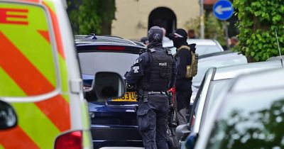 Three men arrested after stand off with armed police in city street