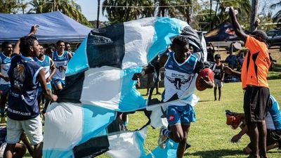 Daly River Buffaloes' only home game lifts community spirits with art and footy festival
