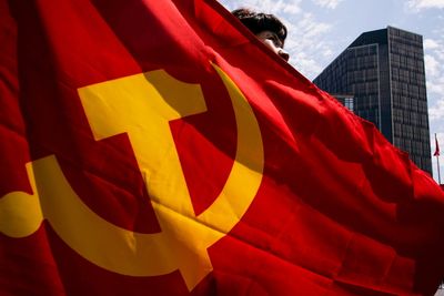 China further reins in business activities of officials' families