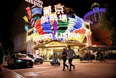 Macau shuts most businesses amid COVID outbreak, casinos stay open