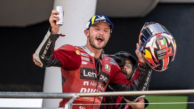 Australian Jack Miller finishes third in the MotoGP then goes out of his way to hand a fan his gloves