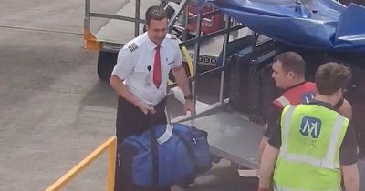 Pilot at Edinburgh airport spotted helping load luggage on to plane