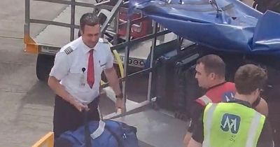 Edinburgh Airport pilot spotted helping staff load passengers bags onto flight