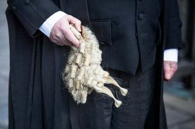 Criminal barristers vote to go on strike as legal aid dispute with government escalates