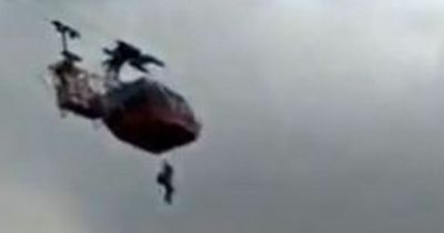 India cable car stuck: Tourists have to climb out using rope as it's stranded high in air