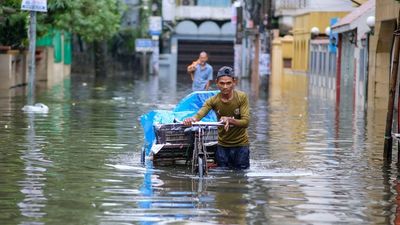 Floods in Bangladesh force military to help millions marooned in towns and villages as Indian flood crisis eases