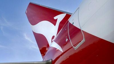 Qantas axes mask requirement on some outbound international flights