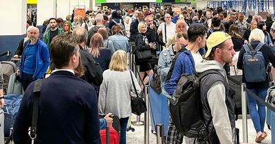 Holidaymakers line up in 'mile-long' queue to check-in as UK airport chaos continues