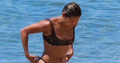 Strictly's Karen Hauer stuns on honeymoon as she braves thong bikini on beach