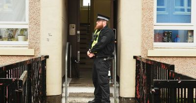Woman found dead in Glasgow flat as police stand guard