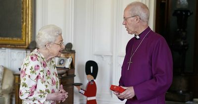 Queen ditches her walking stick as she receives award for her 'unstinting service'