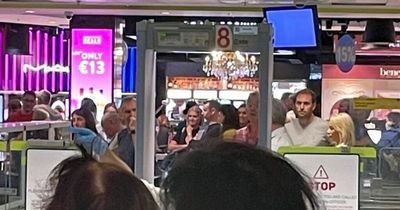 Ryanair boss Michael O'Leary seen on front line at Dublin Airport helping passengers make it onto flights