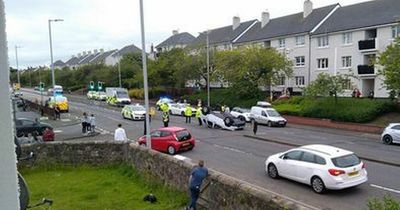 Car flips on to its roof as emergency services race to busy Ayrshire road