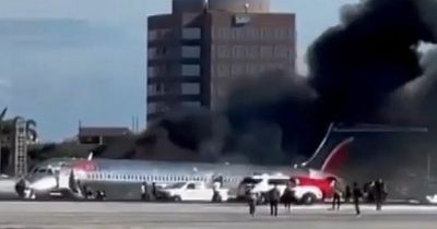 Plane carrying 100 people bursts into flames in Miami runway crash landing horror