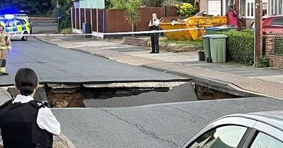 Huge 20ft sinkhole swallows road in London street causing motorbike to fall inside