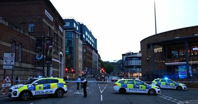 Police still hunting for wanted man after double stabbing in city centre