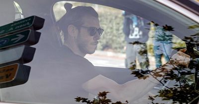 Gareth Bale at Cardiff City training base as he speaks with manager Steve Morison for first time