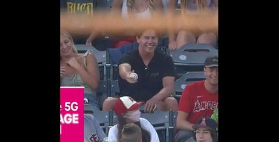 A classy Angels fan gave up a ball to a kid, who adorably returned the favor a few innings later