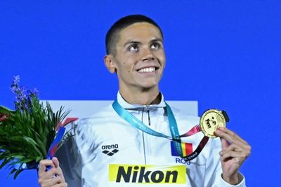 Teens Popovici and McIntosh grab world swimming golds as Dressel quits