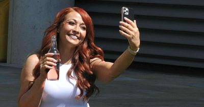 The Apprentice star Amy Anzel enjoys the sunshine with a bottle of cider in Salford