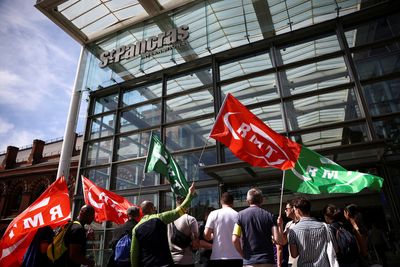 Strikes cripple Britain's railways, BA staff vote for walkout