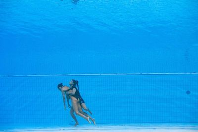 Hero Olympic coach criticises lifeguards as she dives in to save own swimmer: ‘No one was diving in’