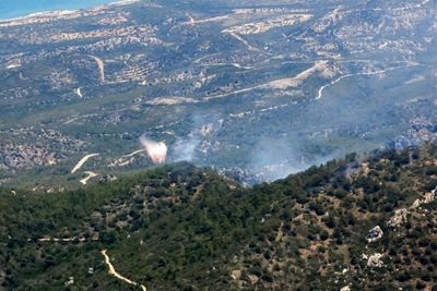 Divided Cyprus joins forces to fight fire