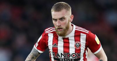 Scotland star Oli McBurnie and Sheffield United teammate charged with assault after pitch invasion