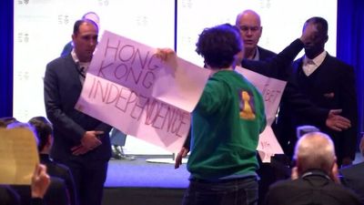 Chinese ambassador Xiao Qian interrupted by multiple protesters during speech at UTS