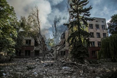 Ukraine loses key town as Russia claims it surrounds troops