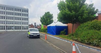 Police tents remain next to Leeds Asda after woman found dead in bushes