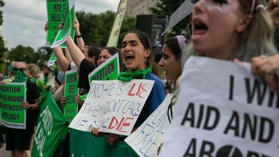 United States Supreme Court overturns Roe v Wade, erasing constitutional right to abortion