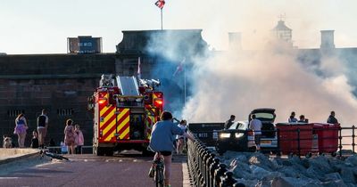 Wirral landmark disappears behind smoke as firefighters tackle 'beach bonfire'