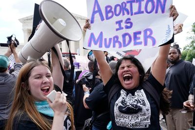 AP PHOTOS: U.S. Supreme Court overturns abortion protection
