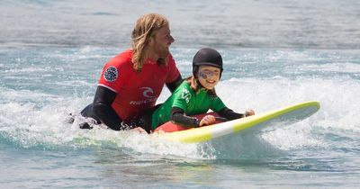 Little girl with cerebral palsy has conquered mountains, triathlons, horse riding and now surfs thanks to an incredible university team