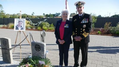 Grave of 'the unknown sailor' rededicated with name 80 years after sinking of HMAS Sydney II