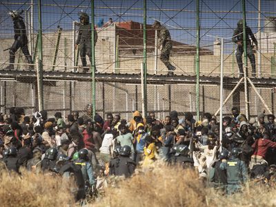 At least 18 migrants die in surge to cross Moroccan border fence into Spain's Melilla