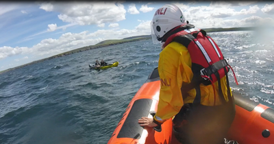 Helicopter and lifeboat crews rescue two Scots kids after blow-up kayak drifts out to sea