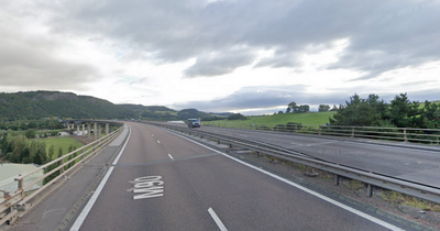 Three people rushed to hospital after crash involving two cars and lorry on M90